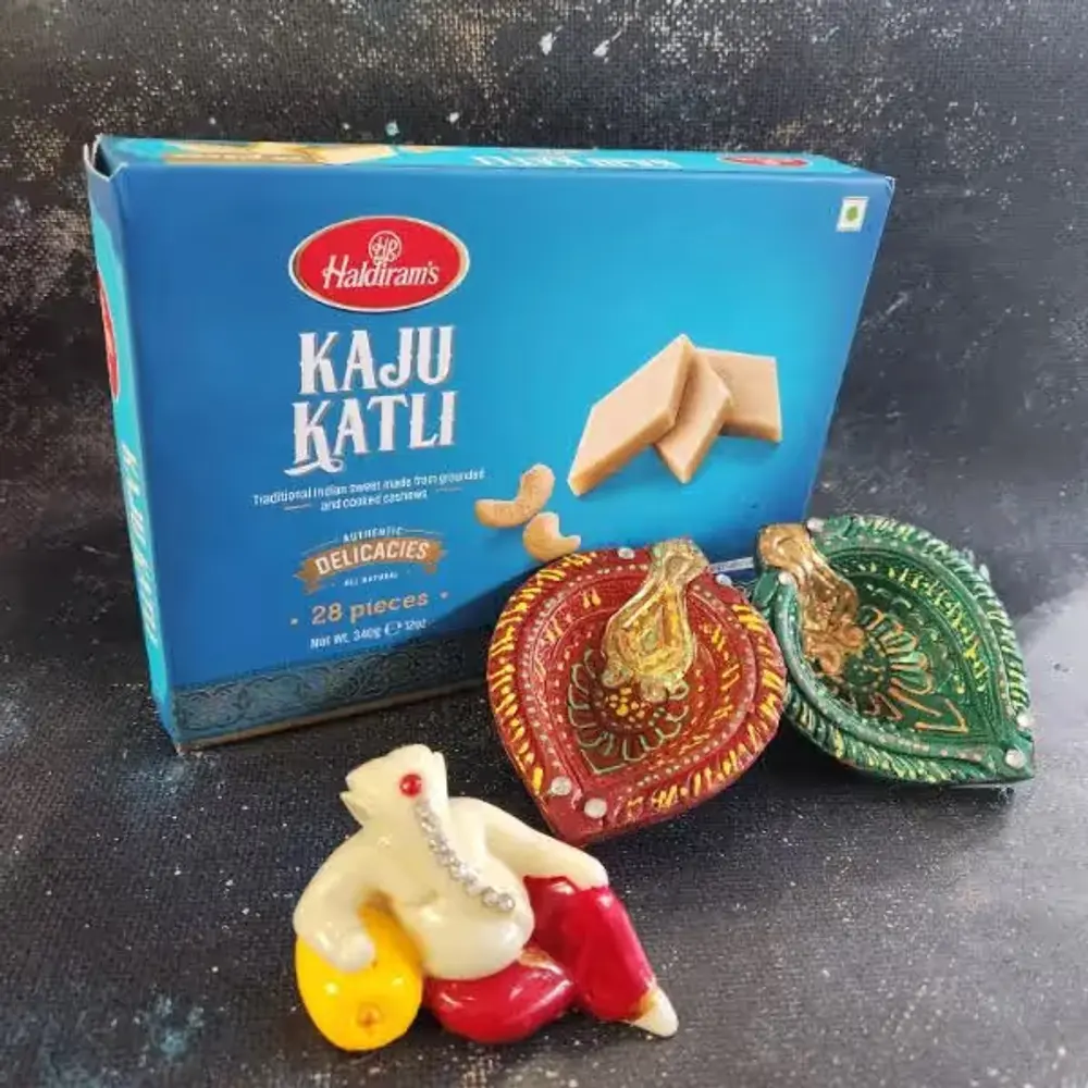 Ganesha Idol, Diyas & Kaju Katli