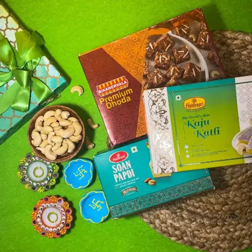 Four Designer Diyas with Sweets