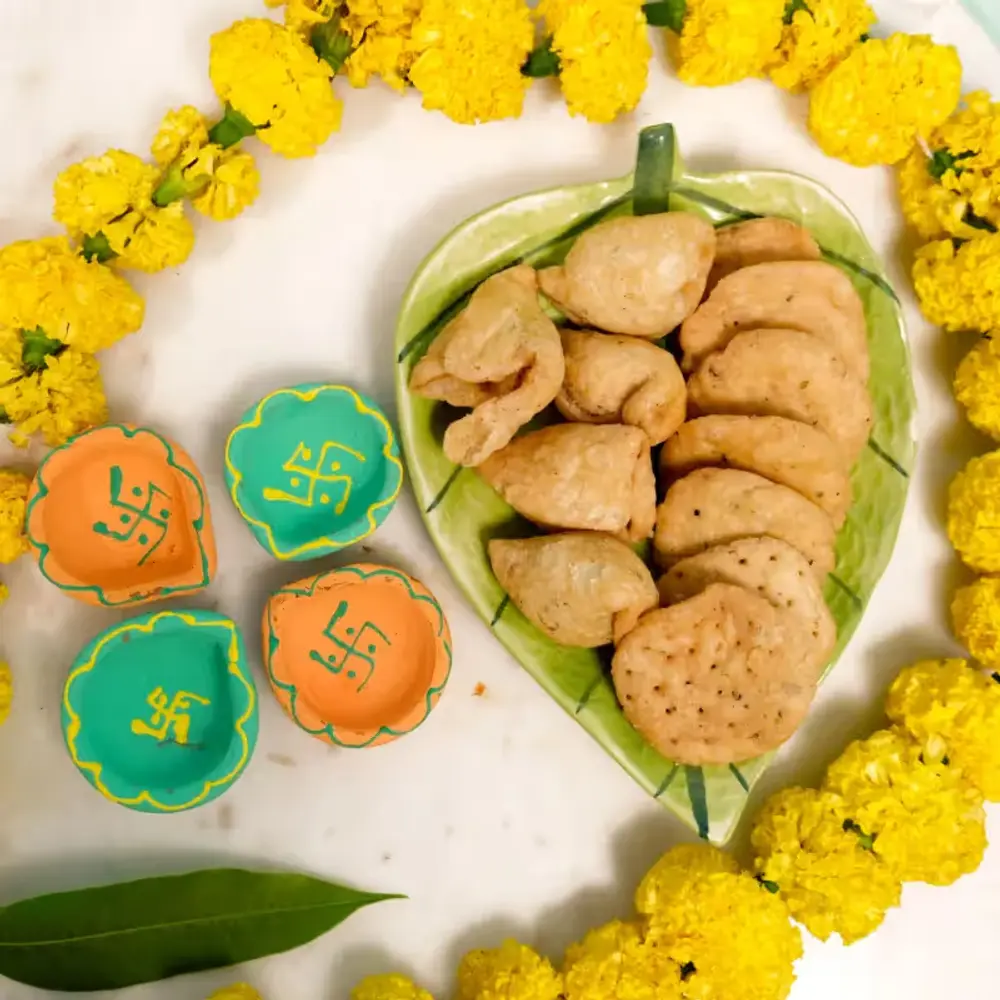 Four Designer Diyas & Snacks