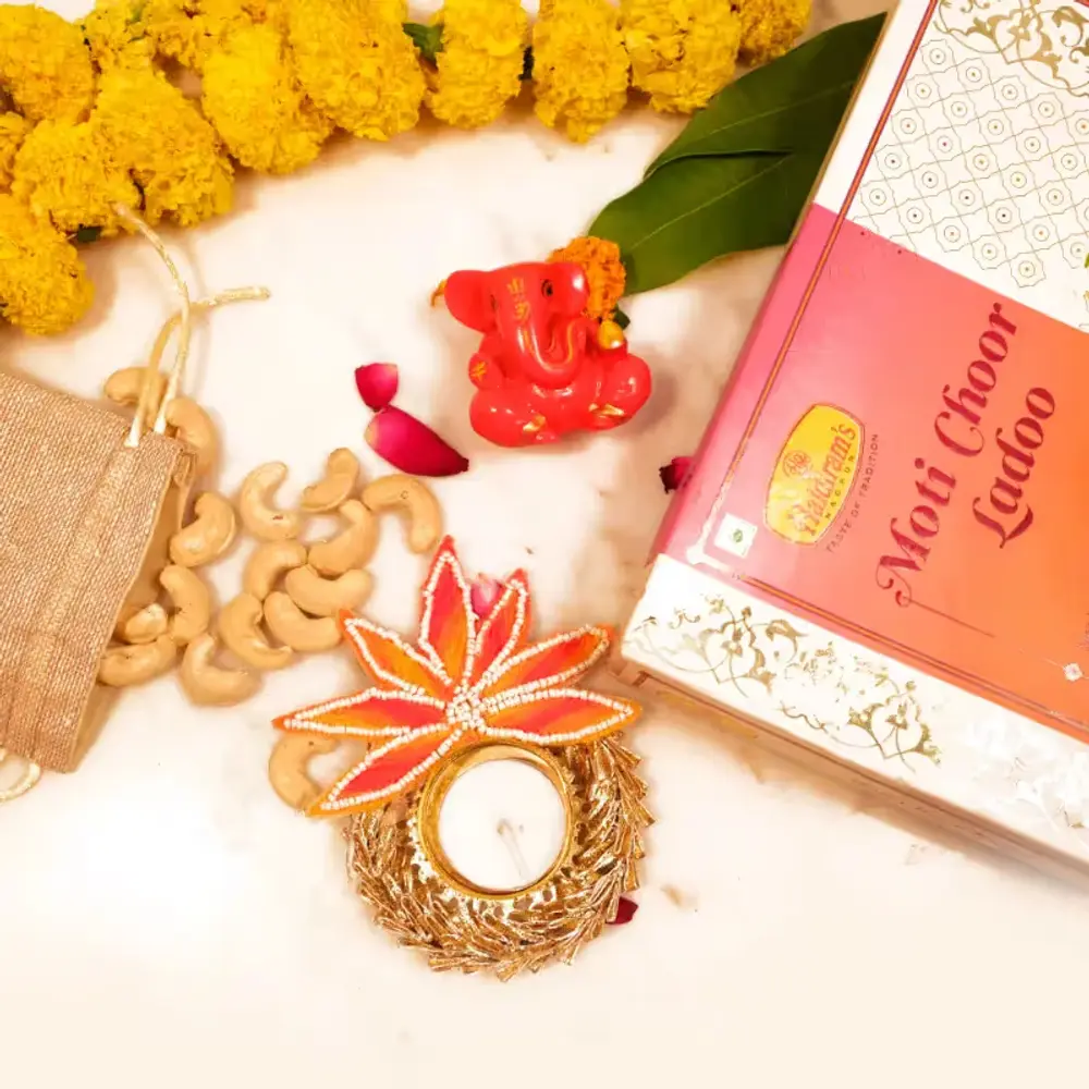 Ganesha Idol, Laddoo, Diya & Cashews
